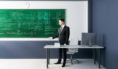 Wall Mural - Businessman with algebra formulas