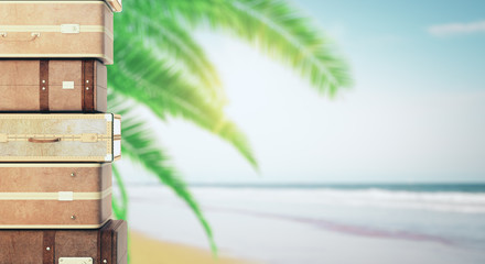 Poster - Stacked suitcases on palm beach background