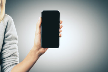 Poster - Female hand with smartphone