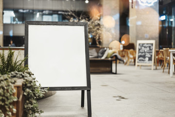 Wall Mural - Close up of sandwich board at the street next to restaurant.