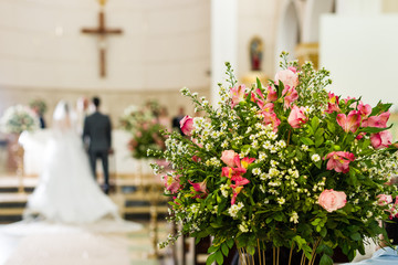 Catholic church decoration for wedding ceremonies - bride and groom on the bare bottom