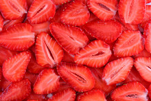 Fresh Strawberry Slice Red Background. Summer Background Texture Of Sliced Strawberries.