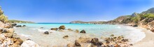 Beautiful Colorful Beach At Crete Island, Greece. Voulisma Paradise Beach With Rocks And Mountains.  Summer Vacation Travel Holiday Background Concept.
