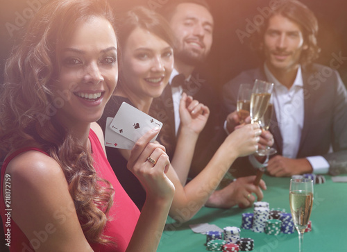 фотография adult group celebrating friend winning blackjack