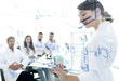 © ASDF - view through the transparent Board. female biochemist makes a report to colleagues