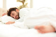 © ASDF - closeup.the tired men sleep soundly on the bed