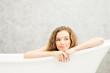 © pic for you - Young woman relaxing in bath.beautiful woman lying in bathtub.