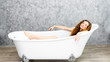 © pic for you - Young woman relaxing in bath.beautiful woman lying in bathtub.
