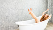 © pic for you - Young woman relaxing in bath.beautiful woman lying in bathtub.