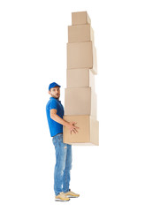 Canvas Print - Full length profile portrait of courier  carrying stack of boxes