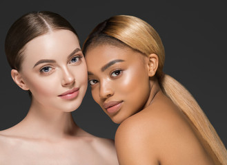 Ethnic beauty skin two women beauty face healthy skin and different colors african and caucasian