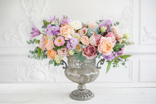 Gorgeous Bouquet Of Different Flowers. Floral Arrangement In Vintage Metal Vase. Table Setting. Lilac And Peach Color