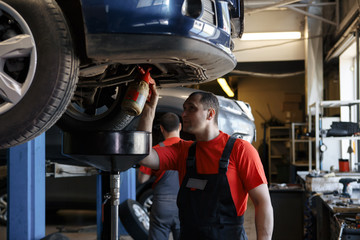 Portrait of a mechanic at work in his garage