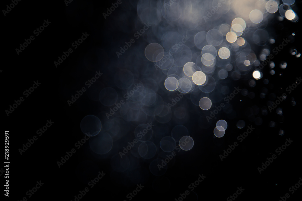 bokeh of water fly and lights on black background, - obrazy, fototapety, plakaty 