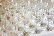 © korsarid - Empty wine glasses standing in row on table
