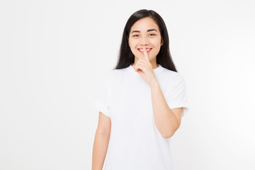 Wall Mural - Shh hush sign. Young asian woman isolated on white background in blank summer t shirt. Copy space. Japanese girl