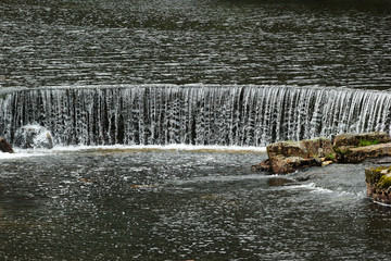 Water cascades on Sira river in Sirdal, Norway.