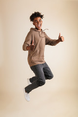 Poster - Full length portrait of a cheerful young afro american man