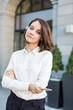 © xartproduction - beautiful young business woman on the street waiting for a meeting with the client