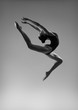 © Yevgeniy - Flexible girl in a jump. Black and white photo.