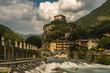 aosta old stone castle with river in north italy cloudy sky