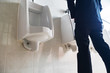 © thexfilephoto - Man standing pee in public toilet