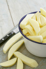 Wall Mural - uncooked chipped potatoes