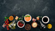 © Yaruniv-Studio - Set of sauces - Ketchup, mayonnaise, mustard, soy sauce, barbecue sauce, pepper and spices. On a black stone background. Top view. Free space for text.