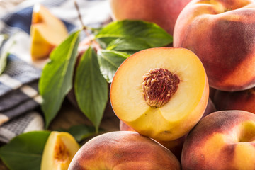 Wall Mural - A group a ripe peaches on wooden table