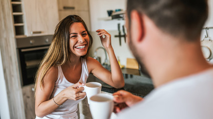 Wall Mural - Happy couple enjoying weekend morning.