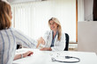 © bnenin - Beautiful cheerful doctor handshake with a patient.