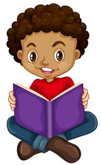 Young boy reading a book