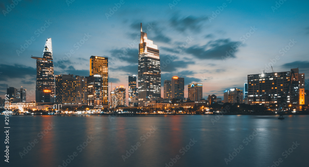 Beautiful landscape sunset of Ho Chi Minh city or Sai Gon, Vietnam. Royalty high-quality free stock image of Ho Chi Minh City with skyscraper buildings - obrazy, fototapety, plakaty 