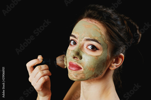 Fotografering portrait of a young attractive woman in a cosmetic mask