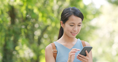 Poster - Woman use of mobile phone over the green background