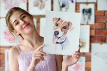Painter Artwork. Creative Painting Hobby. Drawing Skills. Talented Artist Showing Her Picture Of Jack Russell Terrier.