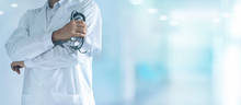 Male Medicine Doctor With Stethoscope In Hand Standing Confidently On Hospital Background
