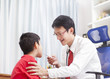 © alexzeer - Portrait of proud doctor with stethoscope.doctor examining a child patient by stethoscope..