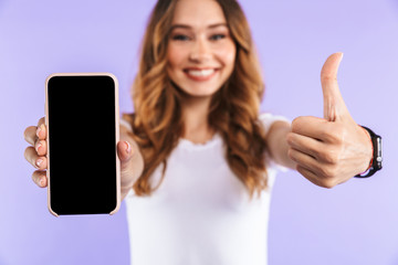 Close up of an excited young girl standing isolated