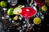Fototapeta  - Red cosmopolitan cocktail with lime