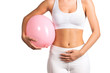 Woman holding a balloon, feeling bloated concept  