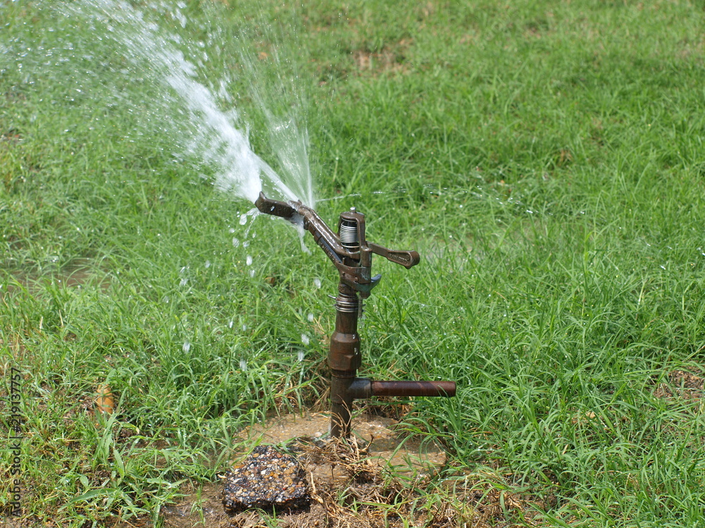 Spring Loaded Sprinker A spring loaded water sprinkler head that has been used on golf courses ...