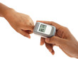 © Choo - woman hand hold pulse oximeter for child used to measure pulse rate and oxygen levels , Patient with pulse oximeter on finger for monitoring