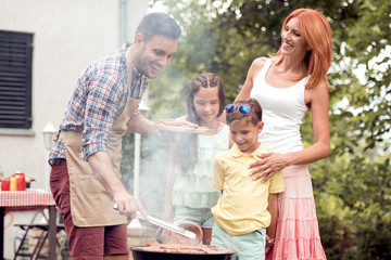 Wall Mural - Family on vacation having barbecue