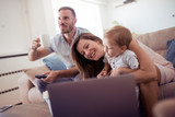 Fototapeta  - Happy family enjojs in living room