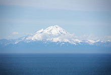 Several Volcanic Peaks Across Cook Inlet In Homer Alaska