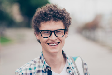 portrait of curly haired cheerful cute attractive handsome smili