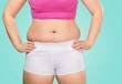© BillionPhotos.com - Close-up female figure with measuring tape on  background