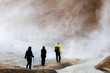 Hikers on the trail through the hot steam from volcanic thermal energy, landmannalaugar National Park, Iceland