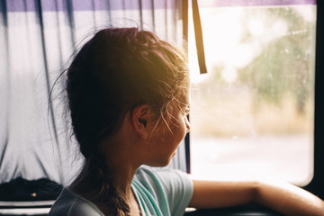 Girl on the bus near the window